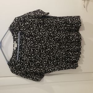 Medium black and white peplum top